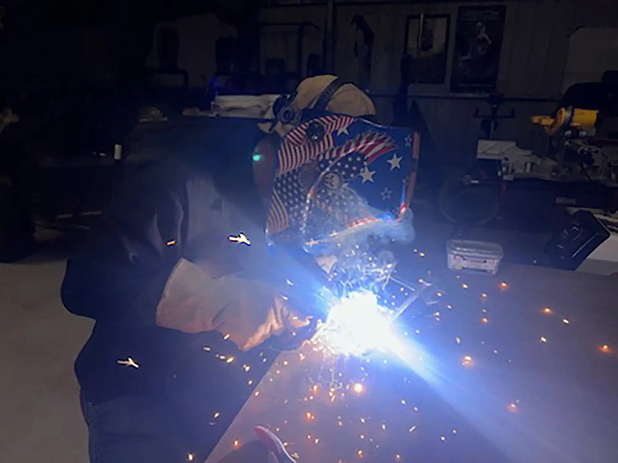 Patriotic welding helmet with stars and stripes design, black material